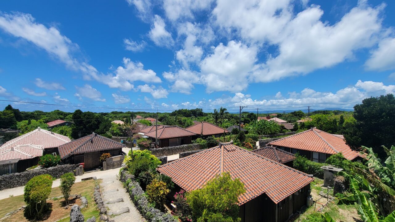 village of traditional Ryukyu houses with red-tiled roofs/Taketomi